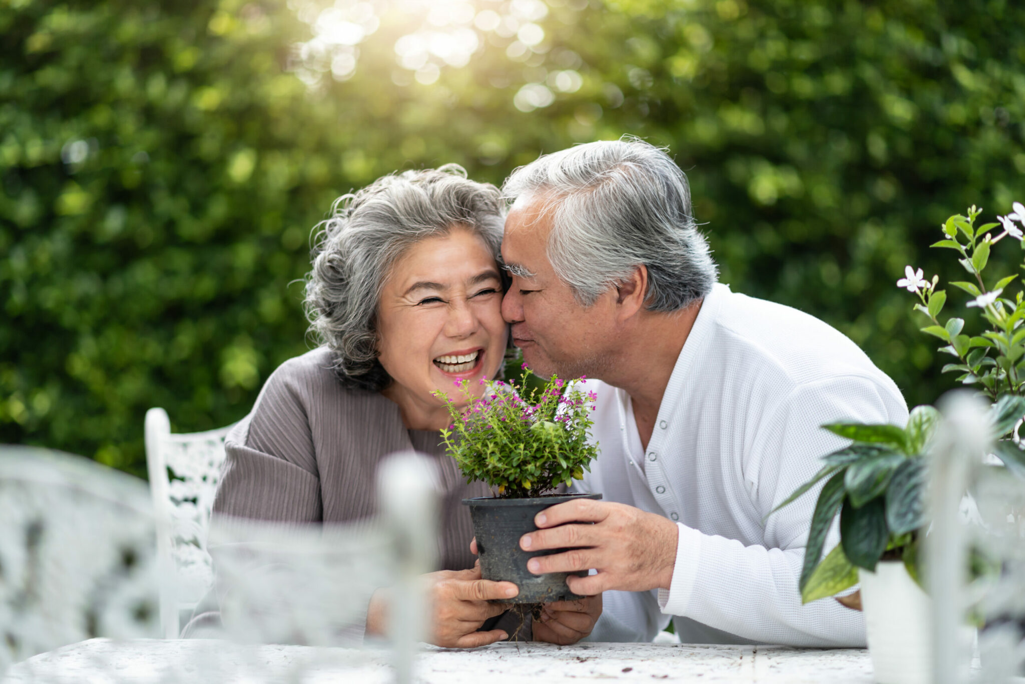 Senior man kissing his wife on the cheek